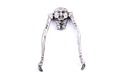 Lot 523 - A pair of late Victorian novelty silver sugar tongs in the form of a stylised “Chinamen”