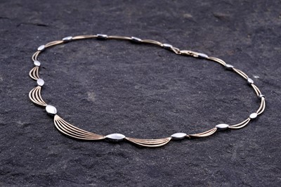 Lot 188 - A contemporary 9ct gold scalloped necklace
