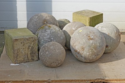 Lot 316 - Seven sandstone Gate Pier finial balls; and a pair of sandstone plinths