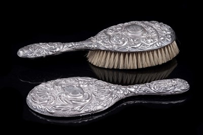 Lot 273 - An Edwardian silver hairbrush; and a hand mirror