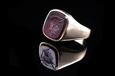 Lot 46 - A 1960s intaglio carved carnelian signet ring depicting the Greek God Hermes
