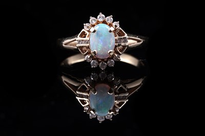 Lot 48 - An Edwardian style opal and diamond ring