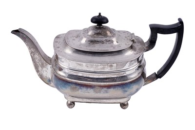 Lot 127 - A George V silver teapot of rounded oblong form