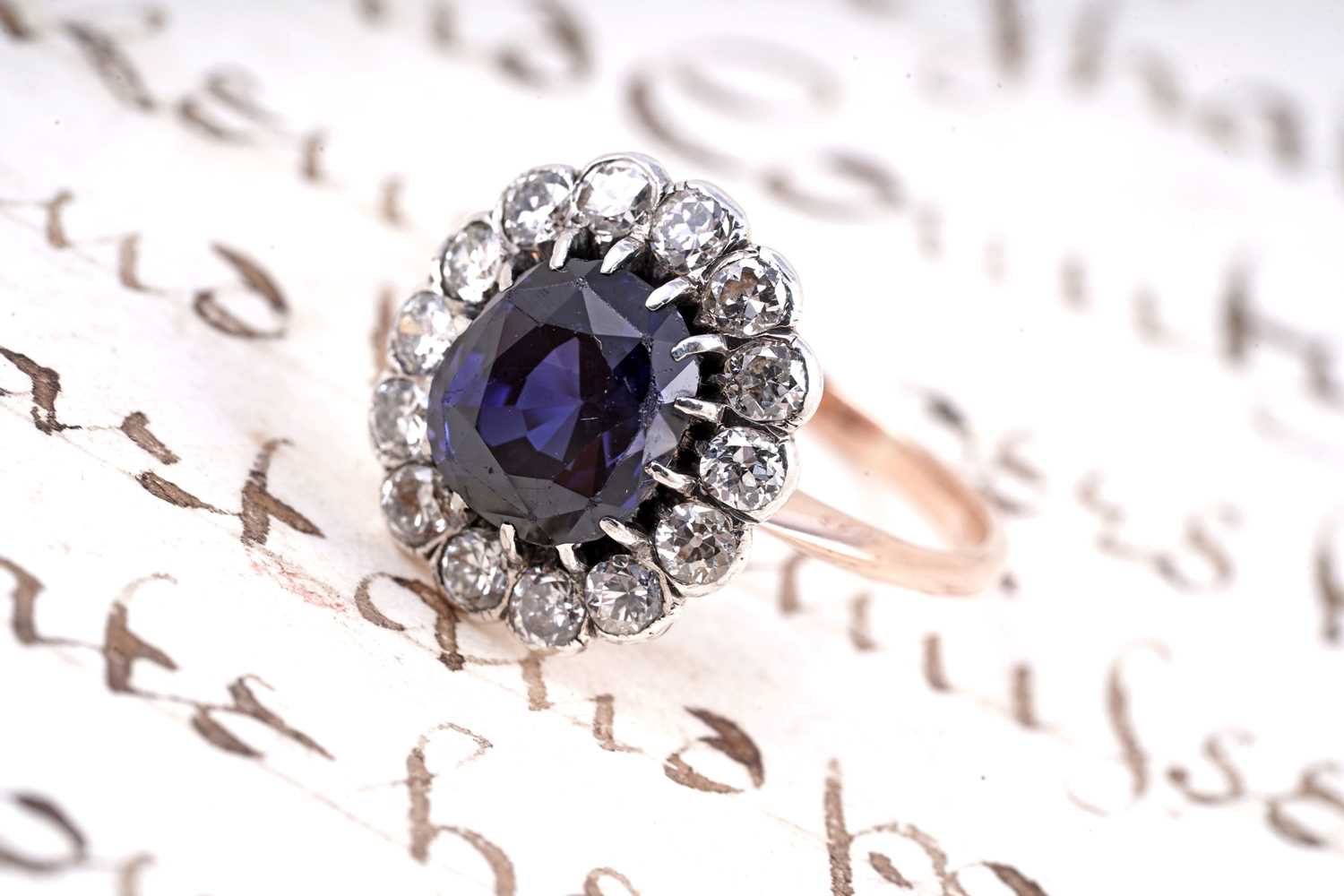 Lot 478 - A sapphire and diamond cluster ring