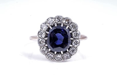 Lot 478 - A sapphire and diamond cluster ring