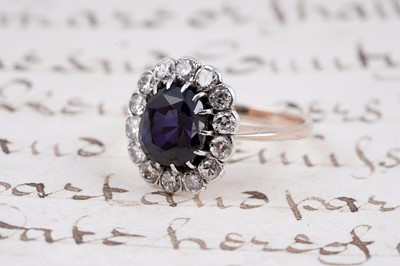 Lot 478 - A sapphire and diamond cluster ring