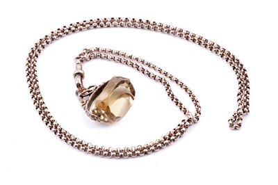 Lot 44 - An early 20th Century 9ct rose gold faceted rolo-link guard chain, and citrine swivel fob seal