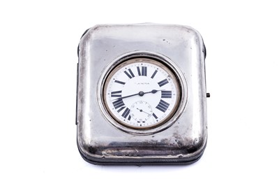 Lot 271 - An Elkington goliath pocket watch in a silver easel-back bedside stand