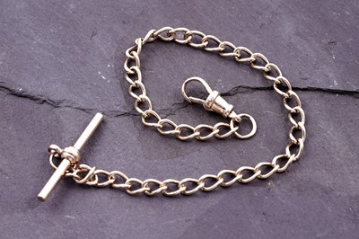 Lot 57 - A 9ct gold curb-link bracelet with T-bar
