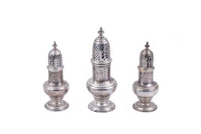 Lot 237 - A George II suite of one large and two smaller silver casters