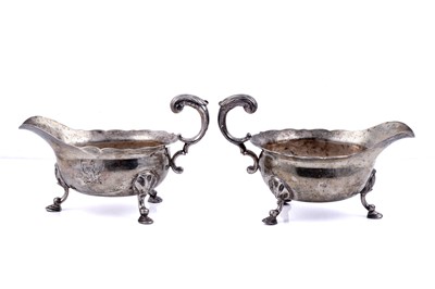 Lot 240 - A pair of George II silver sauceboats
