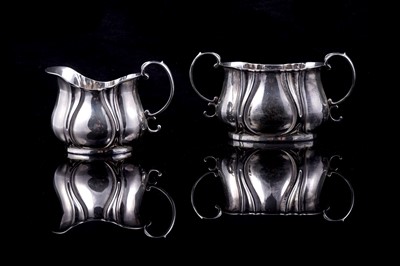 Lot 294 - A Victorian silver Art Nouveau sugar bowl and cream jug