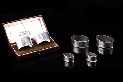 Lot 284 - George V silver napkin rings; and others