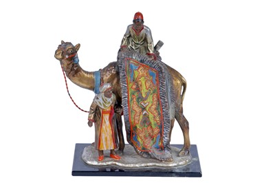 Lot 426 - A cold painted table lighter modelled as two carpet sellers and a camel