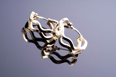 Lot 75 - A contemporary pair of 18ct gold hoop earrings