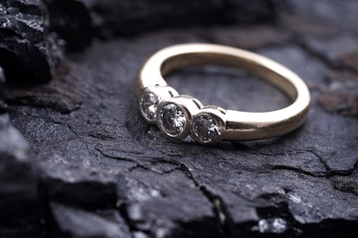 Lot 78 - A contemporary three-stone diamond ring