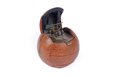 Lot 427 - A novelty table lighter in the form of a leather cased football