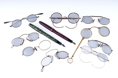 Lot 421 - A selection of 19th Century yellow metal spectacles and lorgnette; and two fountain pens