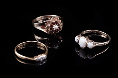 Lot 113 - Three 20th Century gold rings, including a 1960s opal ring