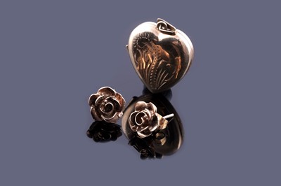 Lot 114 - A pair of 9ct gold stud earrings in the shape of a rose; and a love heart locket