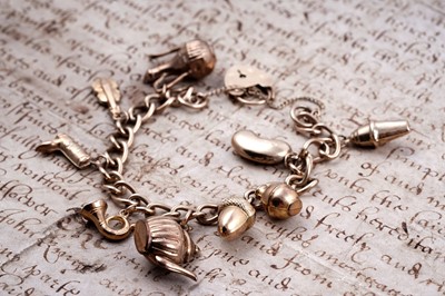 Lot 99 - A 9ct gold curb-link charm bracelet
