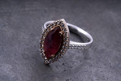 Lot 16 - A no heat ruby and diamond ring