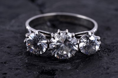 Lot 97 - A modern three-stone cubic zirconia ring on 18ct white gold