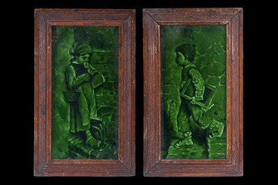Lot 134 - A pair of framed Craven Dunhill green glazed tiles