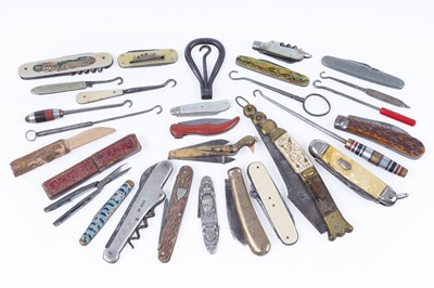 Lot 437 - A collection of pocketknives and button hooks