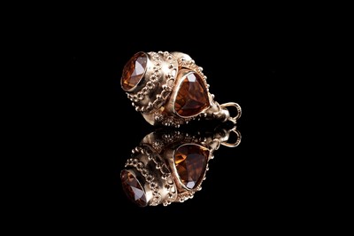 Lot 489 - A citrine and yellow gold fob pendant