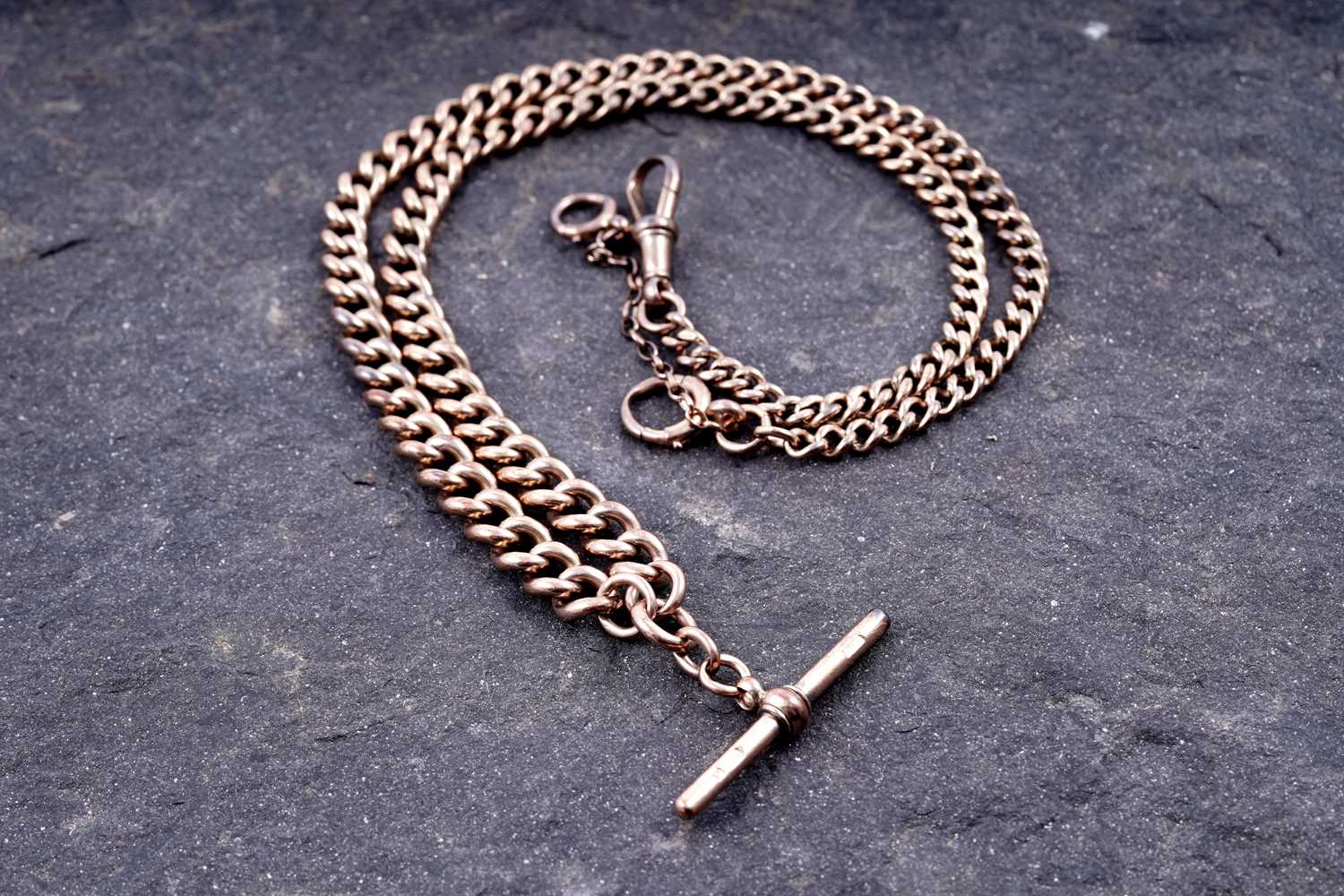 Lot 129 - A 9ct rose gold double "Albert" watch chain