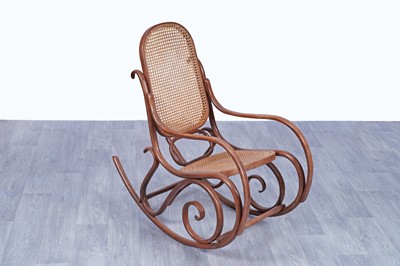 Lot 46 - An early 20th Century beech and bentwood canework rocking chair