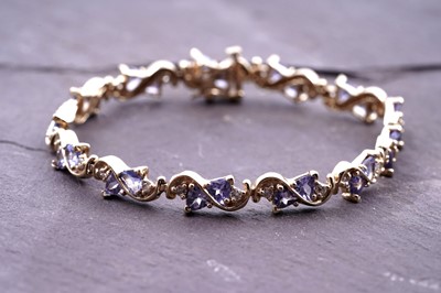 Lot 203 - A contemporary tanzanite and diamond bracelet