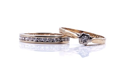 Lot 124 - A cubic zirconia half hoop eternity ring; and a single stone diamond ring
