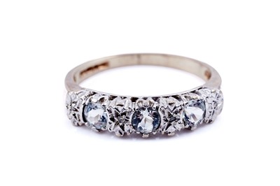 Lot 61 - A modern aquamarine and diamond half hoop eternity ring