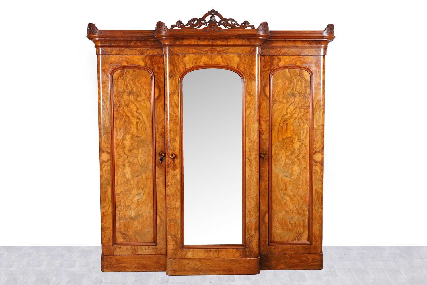Lot 46 - A Victorian burr walnut breakfront triple wardrobe