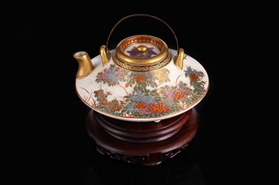 Lot 348 - A Japanese earthenware tea kettle and cover
