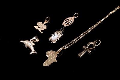 Lot 17 - Egyptian gold pendants and a chain