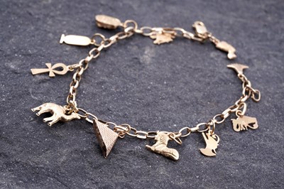 Lot 19 - An 18ct gold belcher-link bracelet with Egyptian 18ct gold charms
