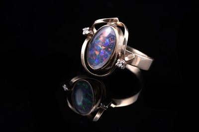 Lot 26 - A black opal triplet and diamond ring