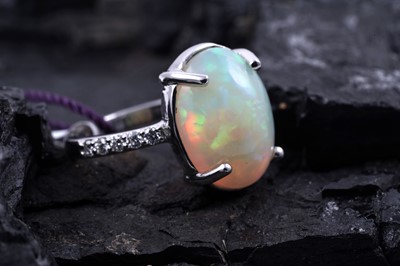 Lot 149 - A contemporary Rhapsody Gilson opal and diamond ring