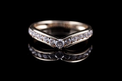 Lot 150 - A contemporary cubic zirconia wishbone eternity ring