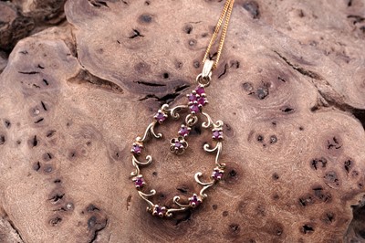Lot 156 - An Edwardian style ruby openwork pendant