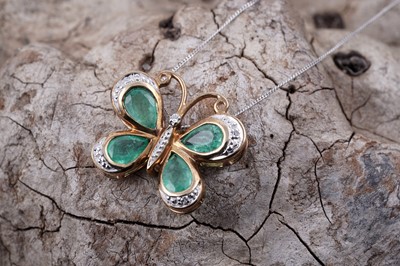 Lot 160 - A contemporary emerald and diamond butterfly pendant