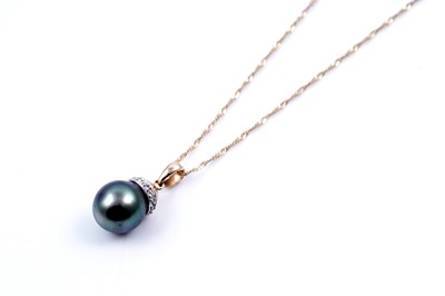 Lot 162 - A contemporary cultured black pearl and diamond pendant on chain