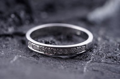 Lot 197 - A contemporary diamond half hoop eternity ring