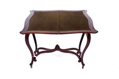 Lot 24 - A late 19th Century continental walnut games table