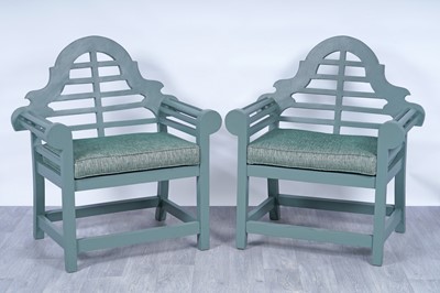 Lot 265 - A pair of Lutyens style hardwood garden chairs