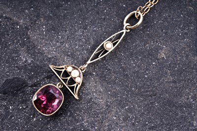 Lot 467 - A pink tourmaline and seed-pearl bell-pattern lavalier necklace