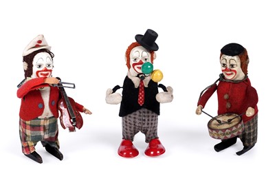 Lot 582 - Three clockwork Schuco clowns